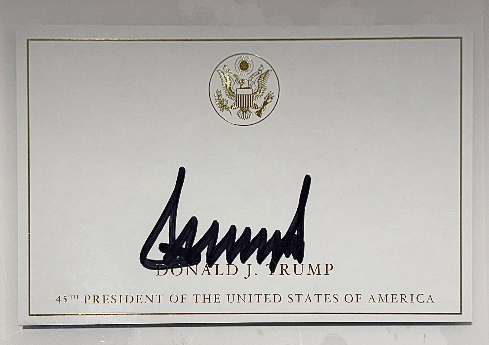 President Donald Trump Signed Autograph Page, Gold Executive Seal. PSA2