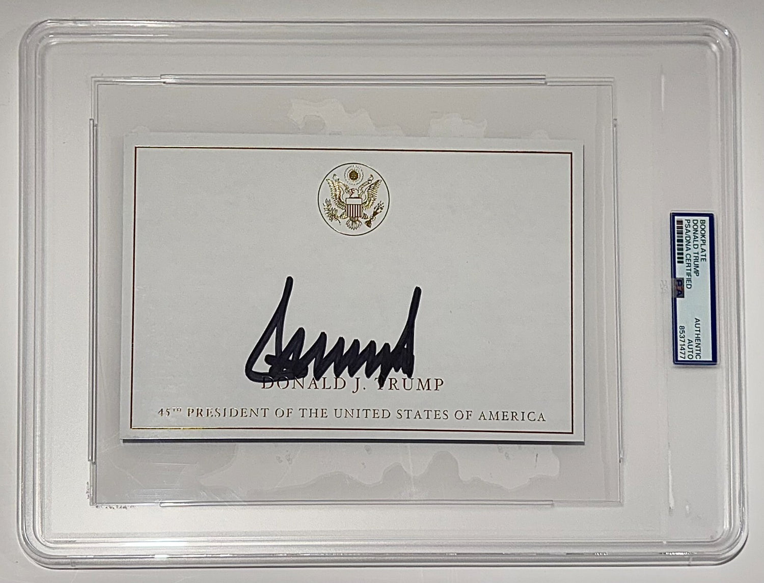 President Donald Trump Signed Autograph Page, Gold Executive Seal. PSA1